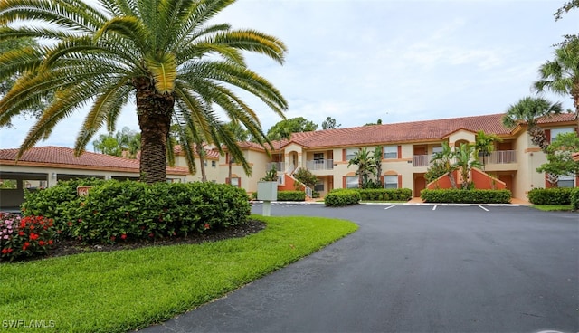 6645 Huntington Lakes Cir Unit 201, Naples, FL 34119 - view of property with uncovered parking