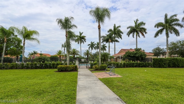 6645 Huntington Lakes Cir Unit 201, Naples, FL 34119 - view of home's community featuring a lawn and fence