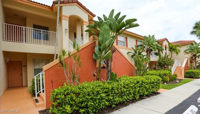 6645 Huntington Lakes Cir Unit 201, Naples, FL 34119 - view of building exterior featuring stairway