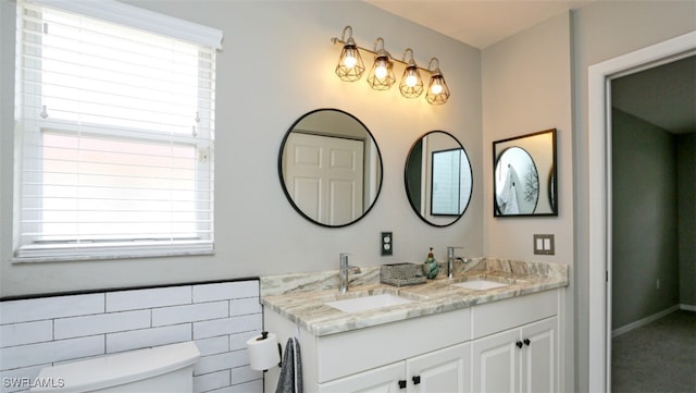 6645 Huntington Lakes Cir Unit 201, Naples, FL 34119 - full bathroom with a wealth of natural light, a sink, and toilet