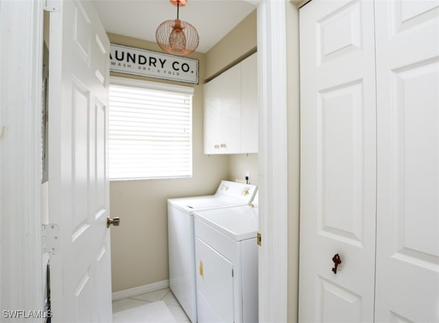 6645 Huntington Lakes Cir Unit 201, Naples, FL 34119 - laundry room featuring cabinet space, independent washer and dryer, baseboards, and light tile patterned flooring