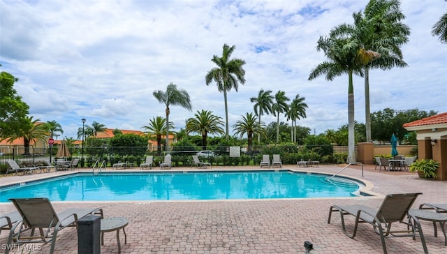 6645 Huntington Lakes Cir Unit 201, Naples, FL 34119 - pool featuring fence and a patio area