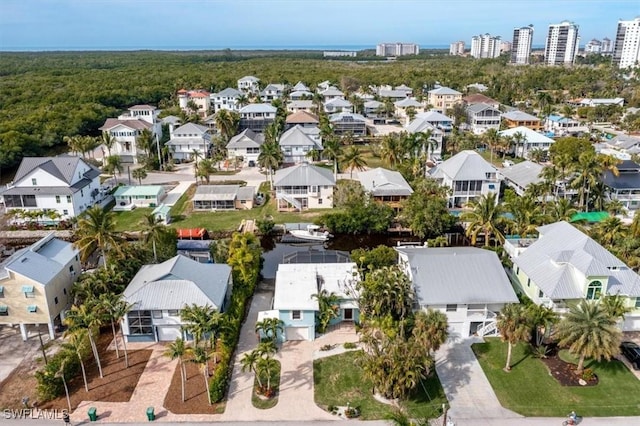 birds eye view of property with a residential view and a forest view