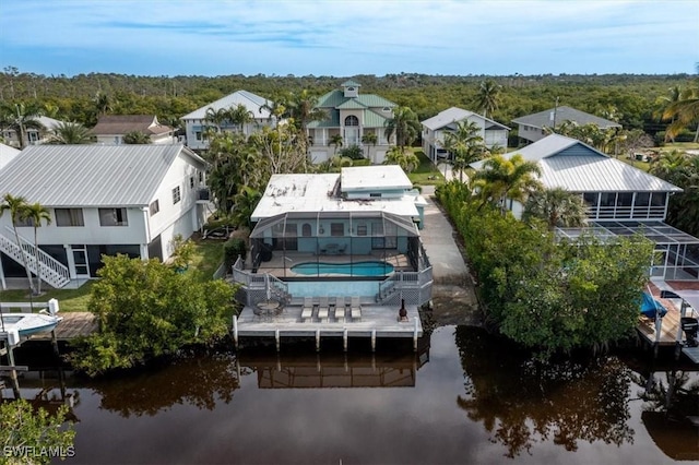 bird's eye view featuring a water view and a residential view