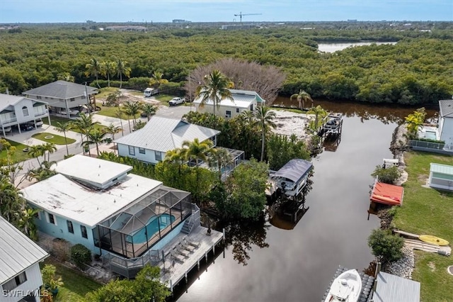 aerial view with a view of trees and a water view