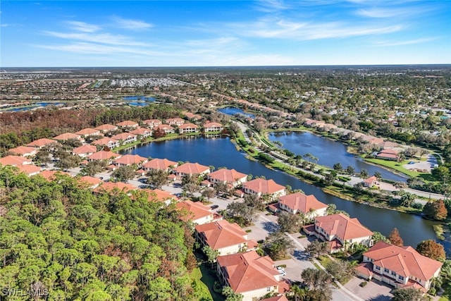 bird's eye view featuring a water view and a residential view