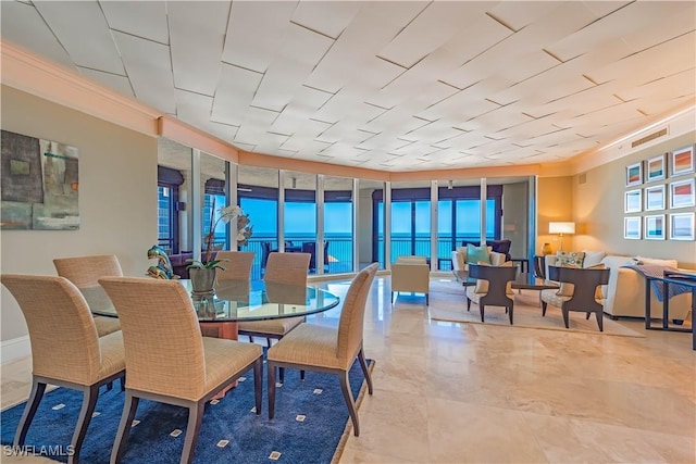 81 Seagate Dr Unit 1101, Naples, FL 34103 - dining room featuring expansive windows