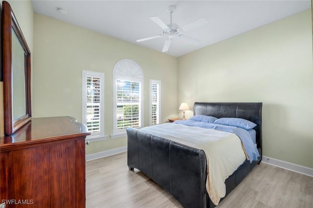 9102 Limestone Ln, Naples, FL 34120 - bedroom featuring light wood-style floors, baseboards, and a ceiling fan