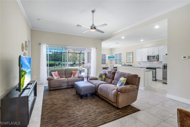 9102 Limestone Ln, Naples, FL 34120 - living area with baseboards, ornamental molding, recessed lighting, light tile patterned floors, and a ceiling fan