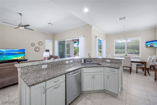 9102 Limestone Ln, Naples, FL 34120 - kitchen with ornamental molding, open floor plan, visible vents, stainless steel dishwasher, and a sink