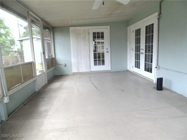 18215 Iris Rd, Fort Myers, FL 33967 - unfurnished sunroom with french doors, a ceiling fan, and healthy amount of natural light
