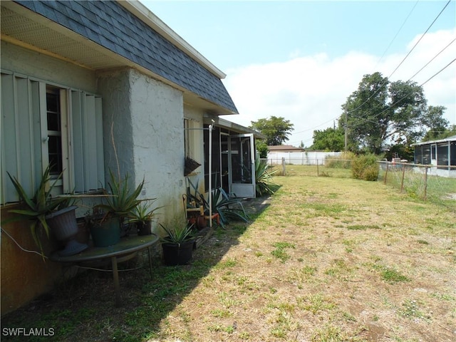 18215 Iris Rd, Fort Myers, FL 33967 - view of yard with a sunroom