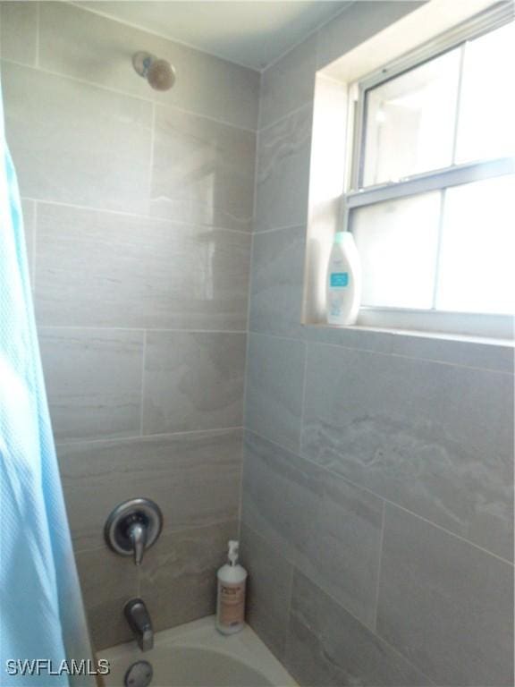 18215 Iris Rd, Fort Myers, FL 33967 - bathroom featuring shower / bath combo with shower curtain