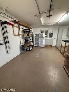18215 Iris Rd, Fort Myers, FL 33967 - basement featuring a garage and washing machine and dryer