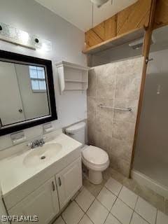 18215 Iris Rd, Fort Myers, FL 33967 - full bathroom featuring vanity, a shower stall, and tile patterned flooring