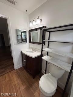 18215 Iris Rd, Fort Myers, FL 33967 - bathroom featuring vanity and wood finished floors