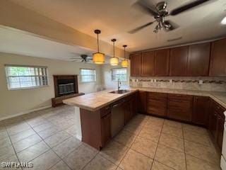 18215 Iris Rd, Fort Myers, FL 33967 - kitchen with ceiling fan, a peninsula, light tile patterned flooring, tasteful backsplash, and plenty of natural light