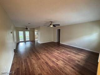 18215 Iris Rd, Fort Myers, FL 33967 - unfurnished living room with dark wood-style flooring and ceiling fan
