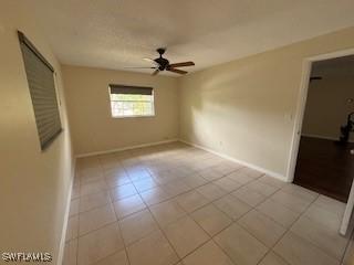 18215 Iris Rd, Fort Myers, FL 33967 - unfurnished room featuring a ceiling fan and light tile patterned floors