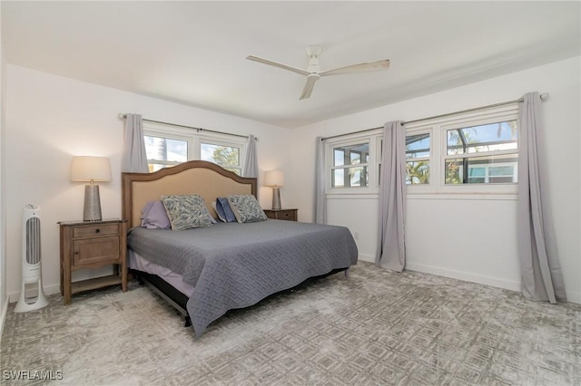 bedroom featuring baseboards and a ceiling fan