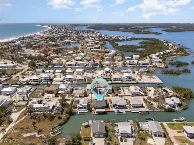 bird's eye view with a residential view and a water view