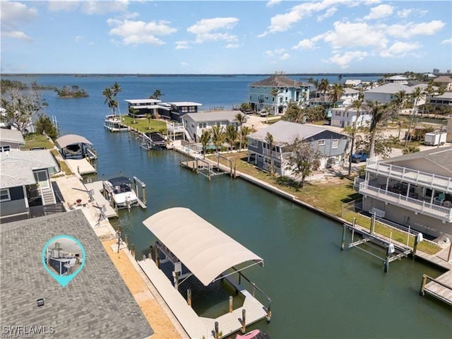 aerial view featuring a residential view and a water view