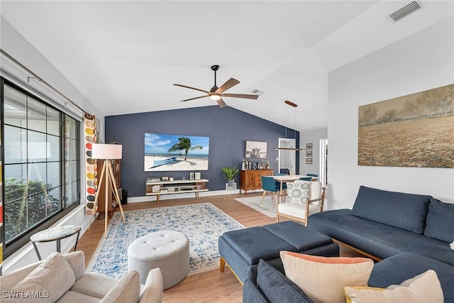 171 Palmetto Dunes Cir, Naples, FL 34113 - living area featuring wood finished floors, vaulted ceiling, and a ceiling fan