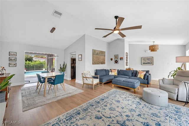 171 Palmetto Dunes Cir, Naples, FL 34113 - living area featuring lofted ceiling, ceiling fan, baseboards, and wood finished floors