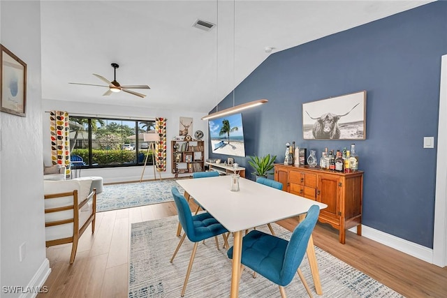 171 Palmetto Dunes Cir, Naples, FL 34113 - dining room with vaulted ceiling, a ceiling fan, wood finished floors, and baseboards