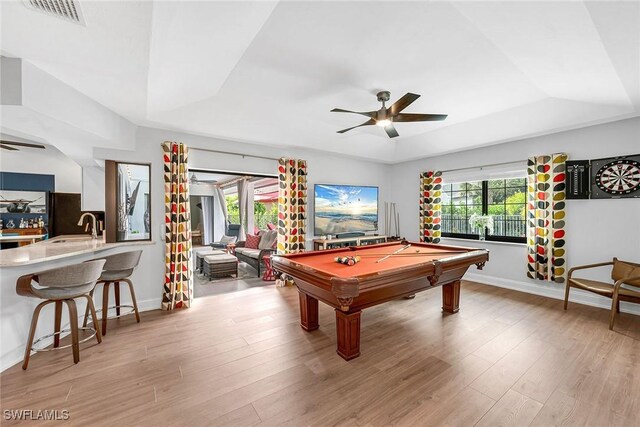 171 Palmetto Dunes Cir, Naples, FL 34113 - recreation room with a tray ceiling, ceiling fan, light wood-style flooring, and billiards