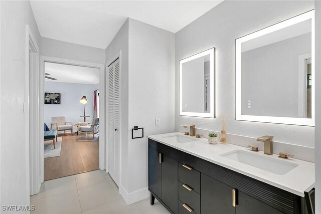 171 Palmetto Dunes Cir, Naples, FL 34113 - full bathroom featuring double vanity, tile patterned flooring, and baseboards
