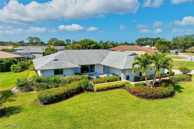 171 Palmetto Dunes Cir, Naples, FL 34113 - ranch-style home with a front yard and stucco siding