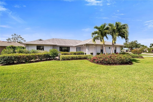 171 Palmetto Dunes Cir, Naples, FL 34113 - ranch-style home with a front yard and stucco siding