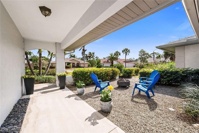 171 Palmetto Dunes Cir, Naples, FL 34113 - view of patio with a fire pit
