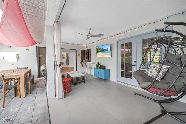 171 Palmetto Dunes Cir, Naples, FL 34113 - sunroom / solarium featuring french doors