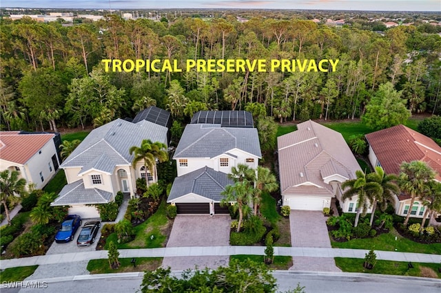 aerial view with a forest view and a residential view