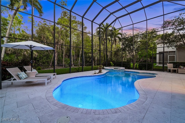 pool at dusk featuring a patio, glass enclosure, and a pool with connected hot tub
