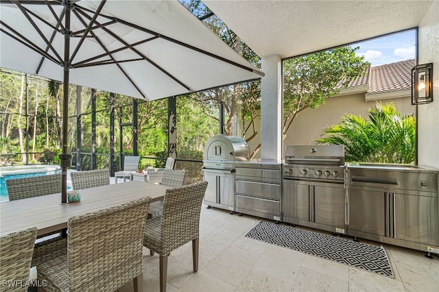 view of patio with exterior kitchen and area for grilling