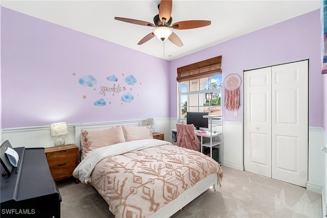 bedroom with carpet floors, a ceiling fan, and a closet
