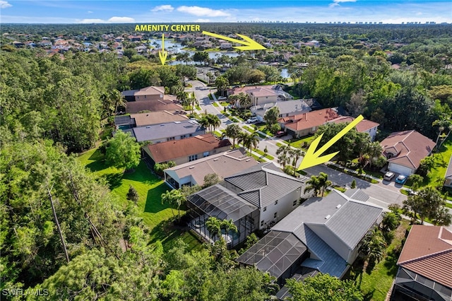 birds eye view of property with a residential view and a water view