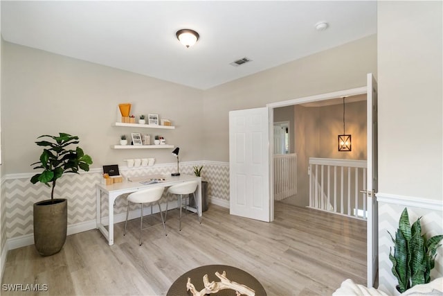 2338 Butterfly Palm Dr, Naples, FL 34119 - home office featuring wood finished floors, a wainscoted wall, and baseboards