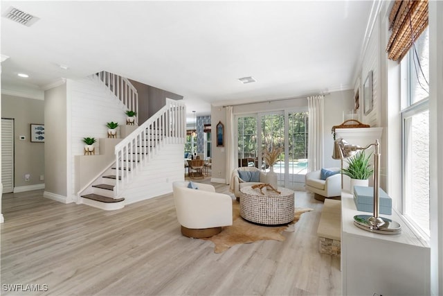 2338 Butterfly Palm Dr, Naples, FL 34119 - living room with stairway, wood finished floors, crown molding, and baseboards