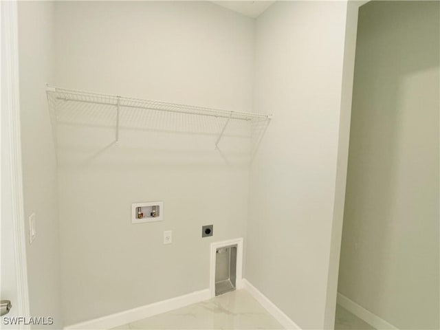 1103 Tropicana Pkwy W, Cape Coral, FL 33993 - clothes washing area with electric dryer hookup, baseboards, washer hookup, laundry area, and marble finish floor