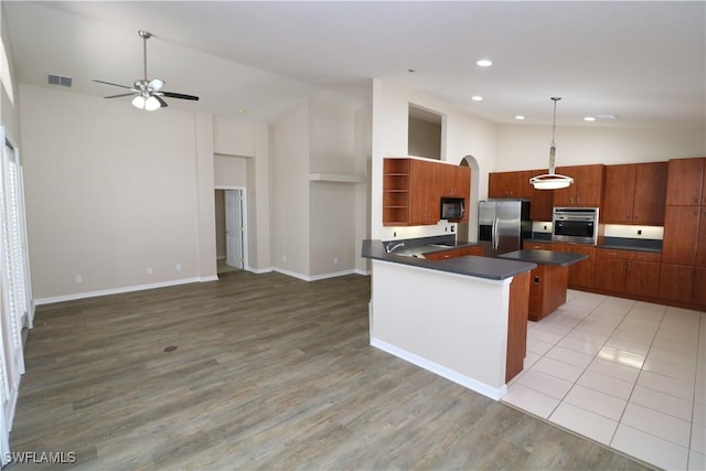 kitchen with visible vents, open shelves, dark countertops, appliances with stainless steel finishes, and a ceiling fan