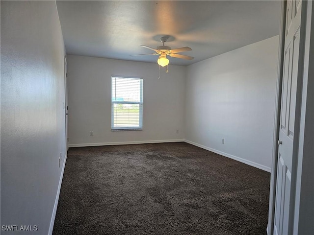 7027 Palpano Cir, Labelle, FL 33935 - unfurnished room with baseboards, a ceiling fan, and dark colored carpet