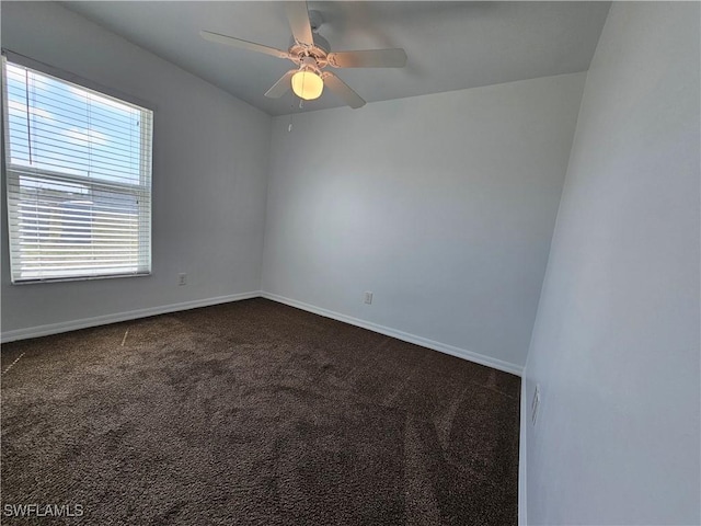 7027 Palpano Cir, Labelle, FL 33935 - spare room with dark carpet, baseboards, and a ceiling fan