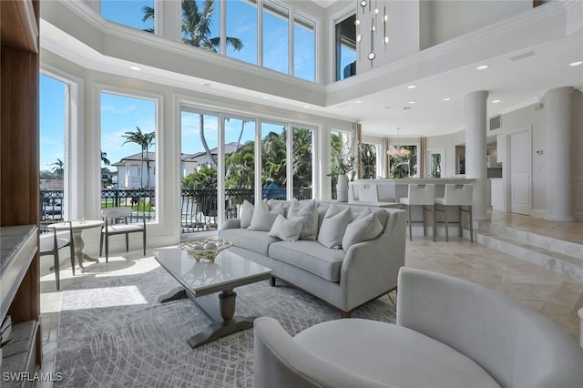 152 Conners Ave, Naples, FL 34108 - living room with a high ceiling, visible vents, and recessed lighting