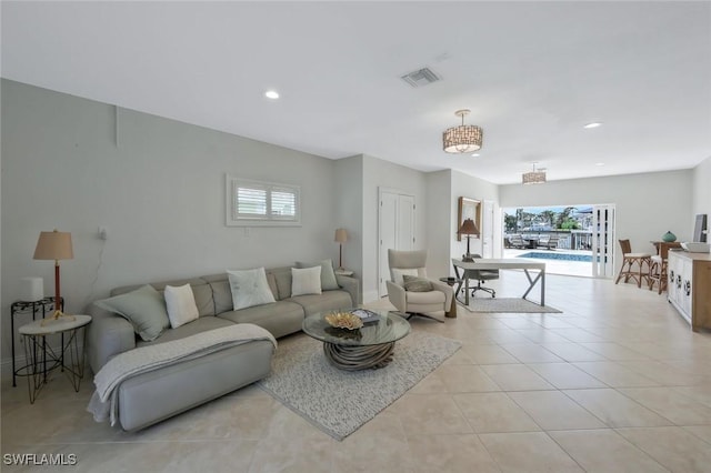 152 Conners Ave, Naples, FL 34108 - living area with light tile patterned floors, recessed lighting, visible vents, and a wealth of natural light