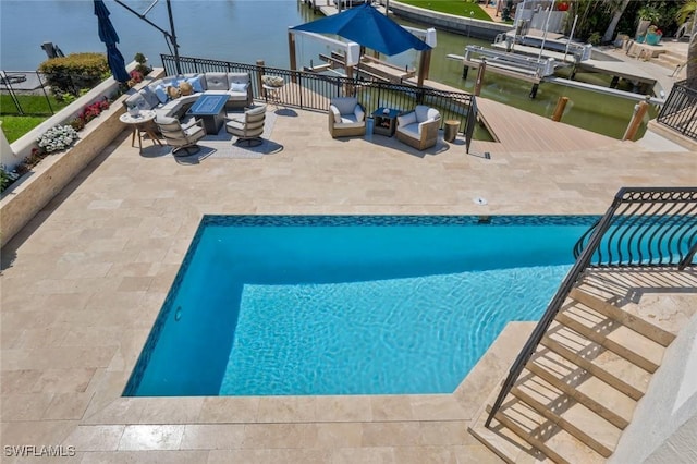 152 Conners Ave, Naples, FL 34108 - view of swimming pool featuring a fenced in pool, a patio, outdoor lounge area, a dock, and a water view