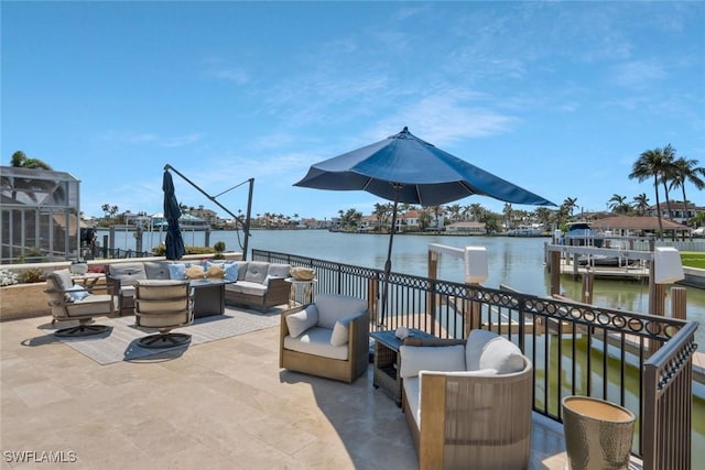 152 Conners Ave, Naples, FL 34108 - view of patio with a water view, a boat dock, and outdoor lounge area
